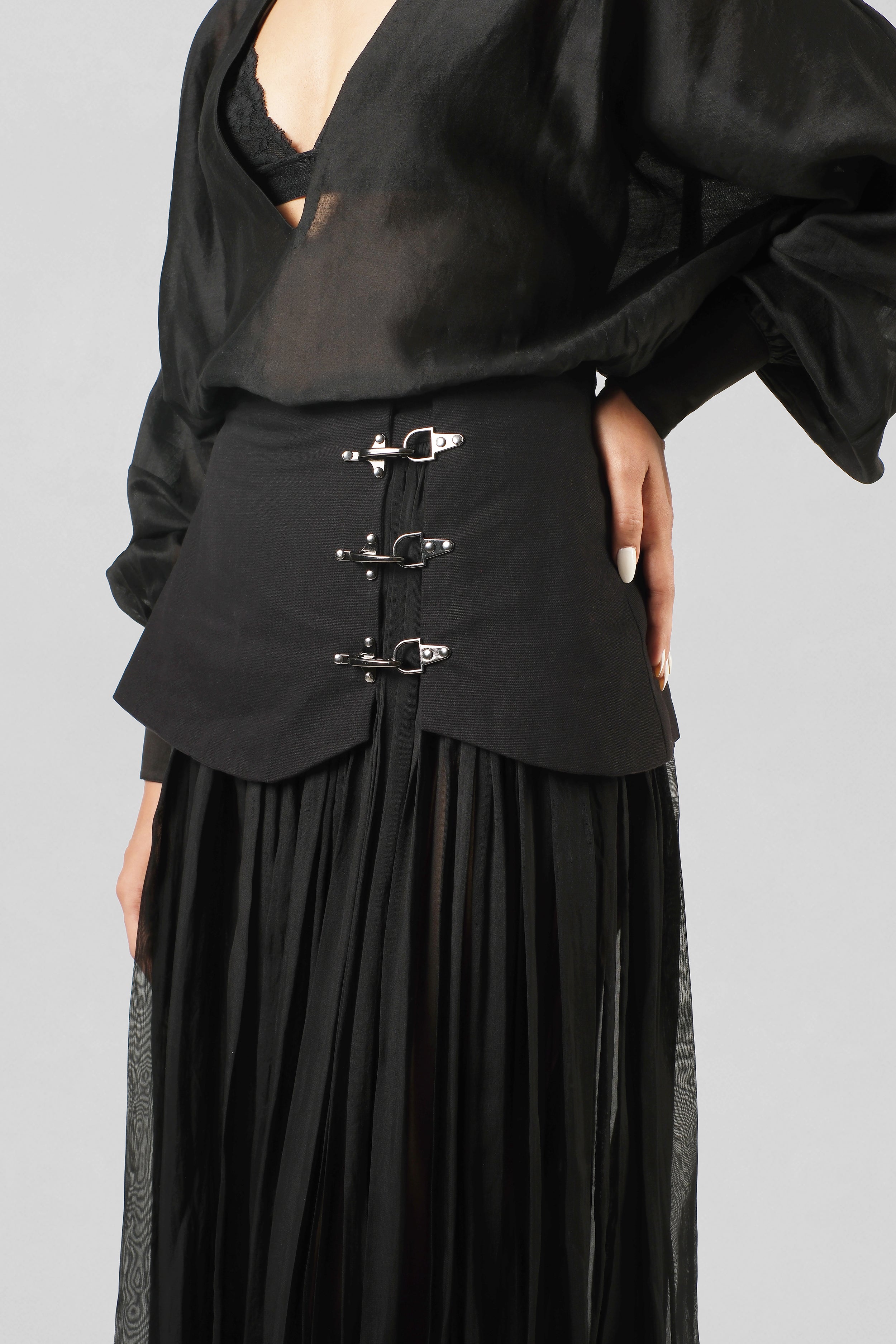 Rekha Skirt by House of Lore crafted in black viscose organza and cotton canvas featuring layered movement and structured buckle detailing