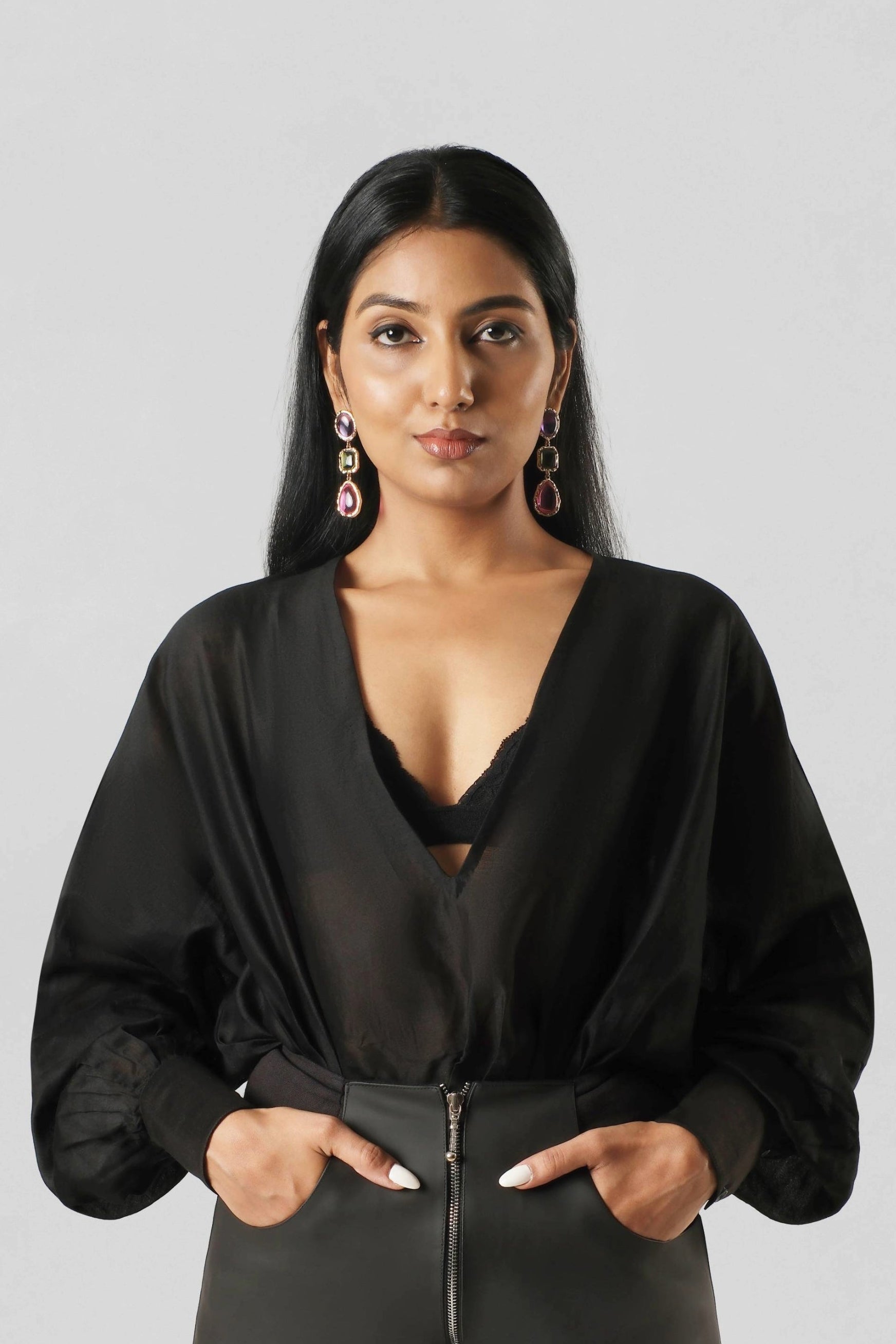Front view of the House of Lore RiRi Top in black Chanderi featuring a deep wrap V-neckline, voluminous balloon sleeves and softly gathered waist.