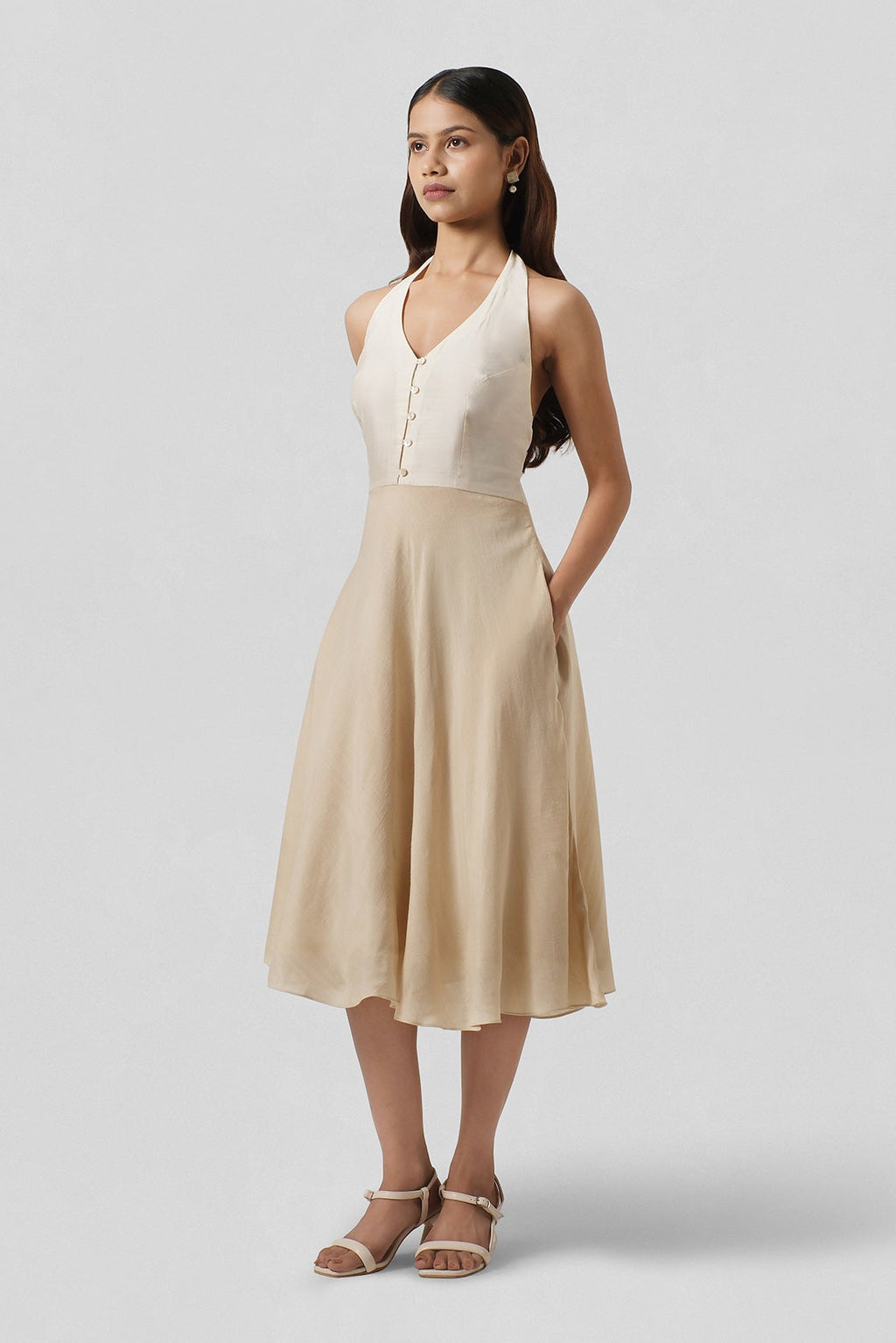 Full-length view of the Diana Gold Chiniya and Muga Silk halter dress featuring timeless occasion-wear elegance.