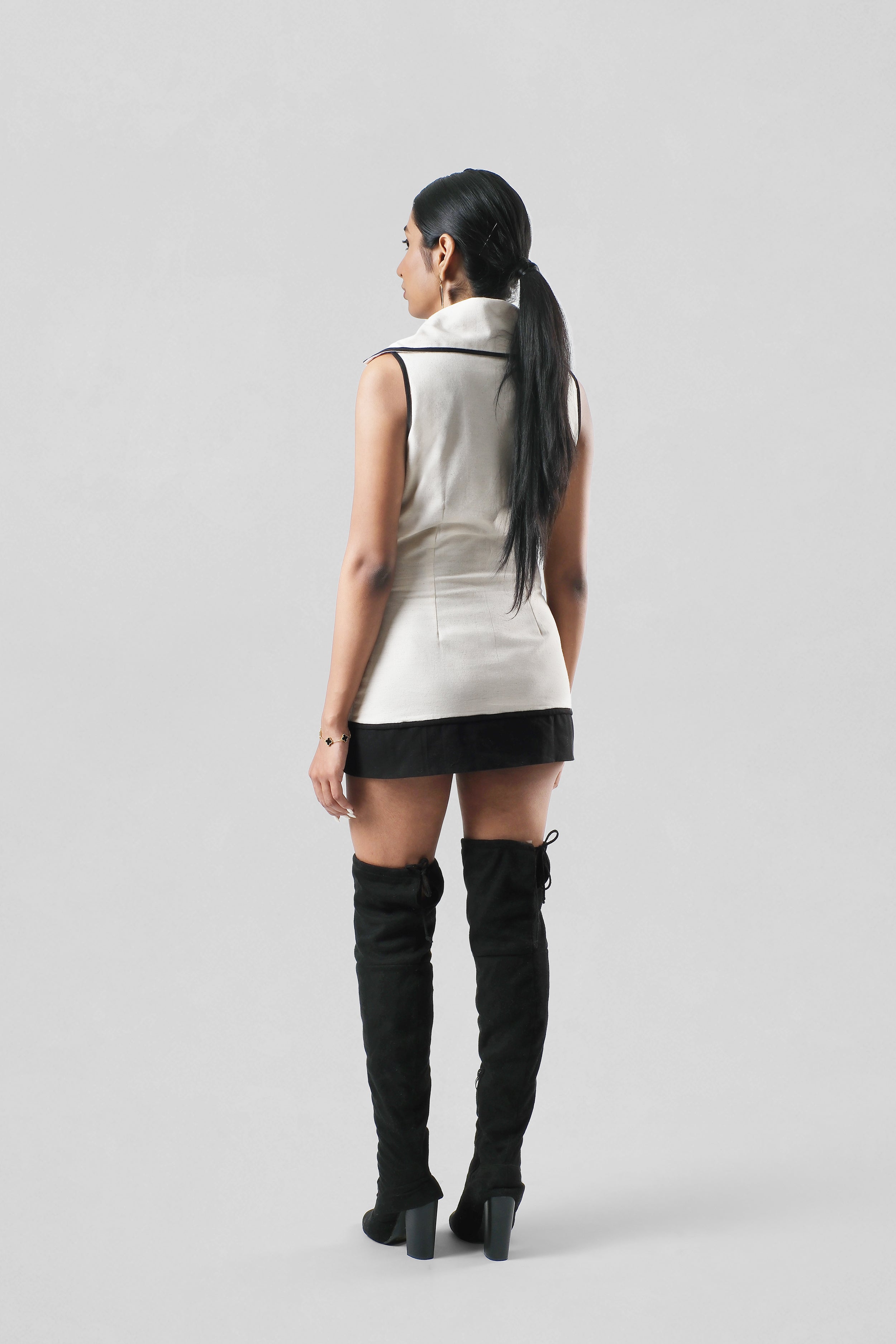 Full-length back view of the Amelia Dress showcasing its clean lines, modern silhouette, and handcrafted finish.