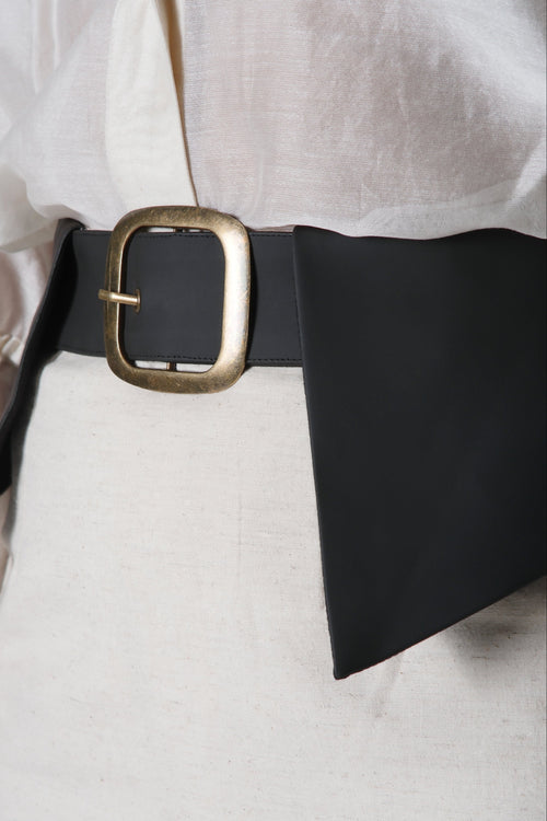 Close-up of the Cleo Skirt highlighting the handcrafted cactus leather waist panel, premium linen fabric and refined artisan finishing.