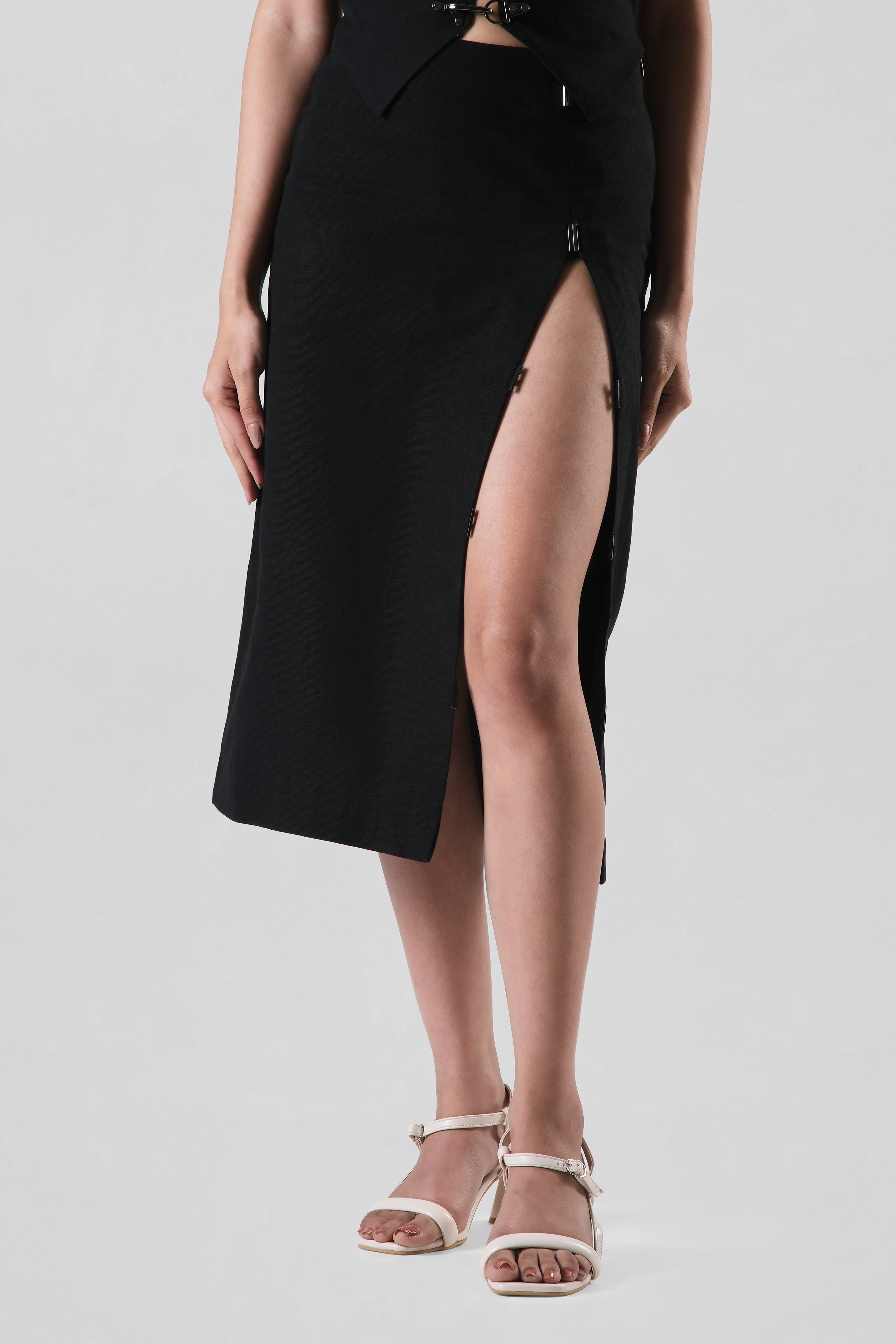 Detail of the Elizabeth Skirt highlighting the elegant front slit and clean tailored finish.
