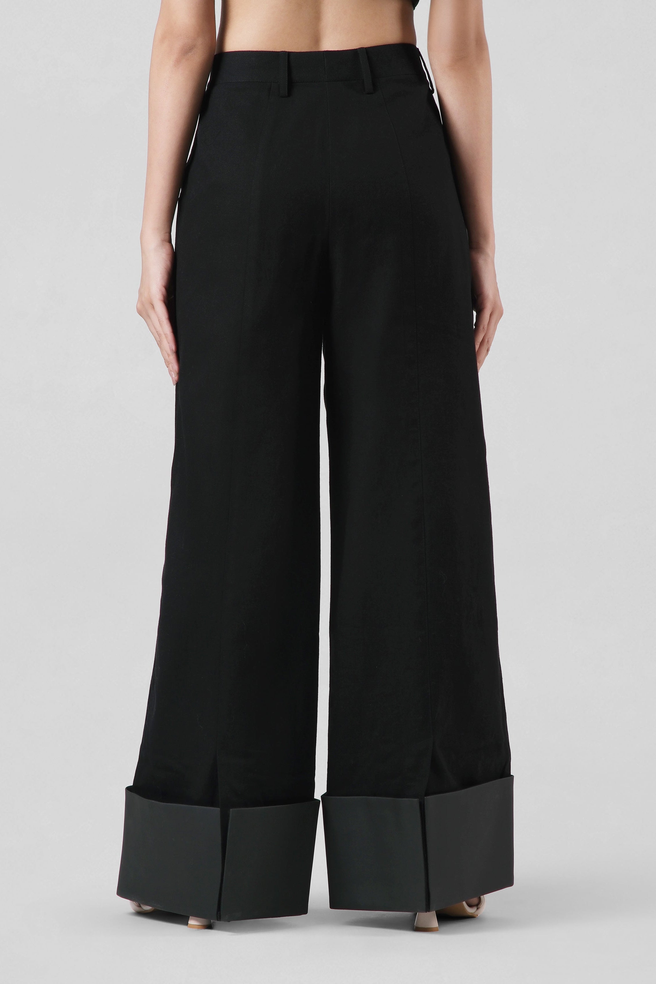 Model wearing the Jane Trousers in black styled as a contemporary luxury wardrobe essential by House of Lore.