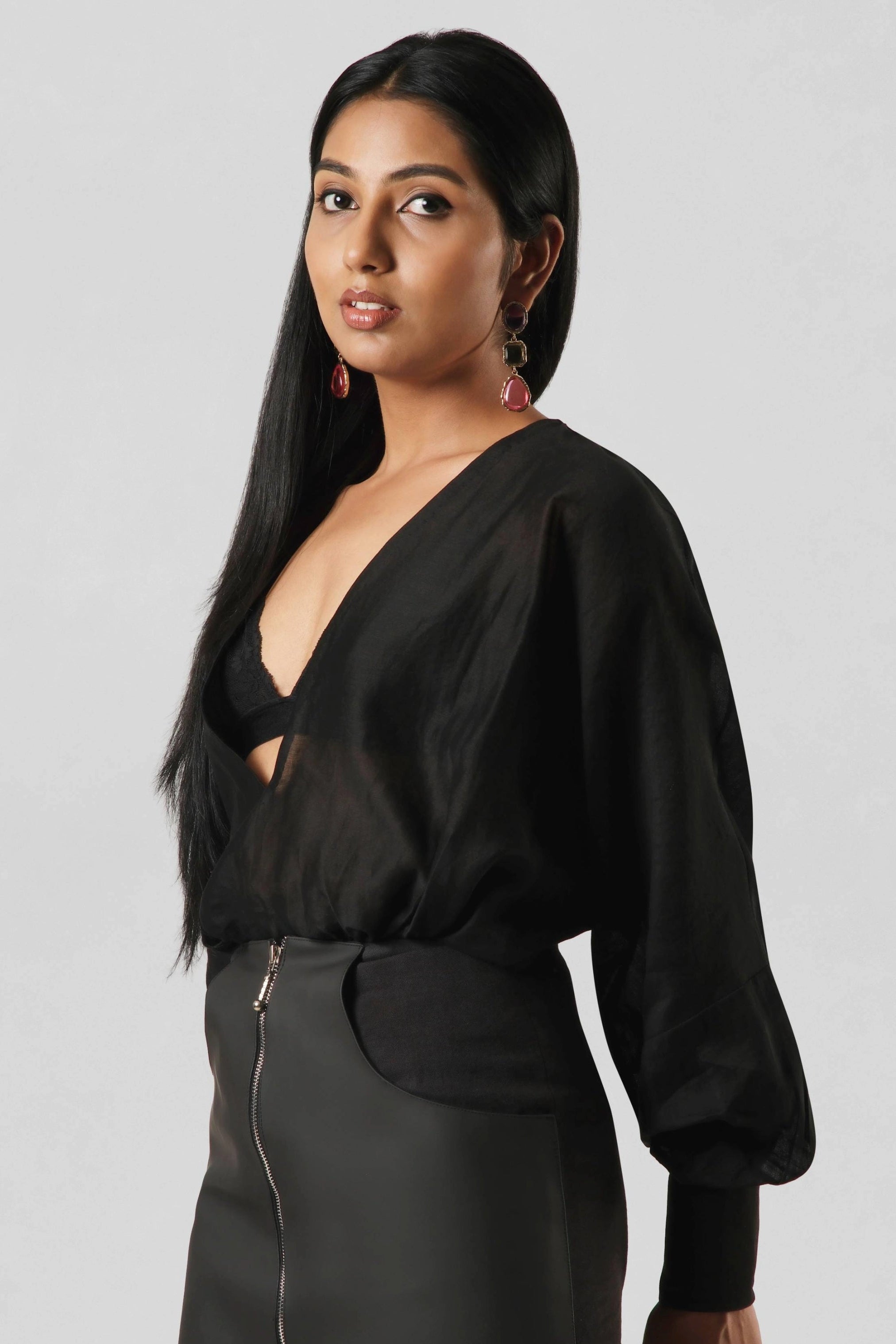 Three-quarter view of the RiRi Co-ord showcasing the relaxed Chanderi top and contemporary cactus leather skirt silhouette.