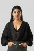 Front view of the RiRi Top in handcrafted black Chanderi featuring a relaxed silhouette, deep V-neckline, and elegant fluid drape.