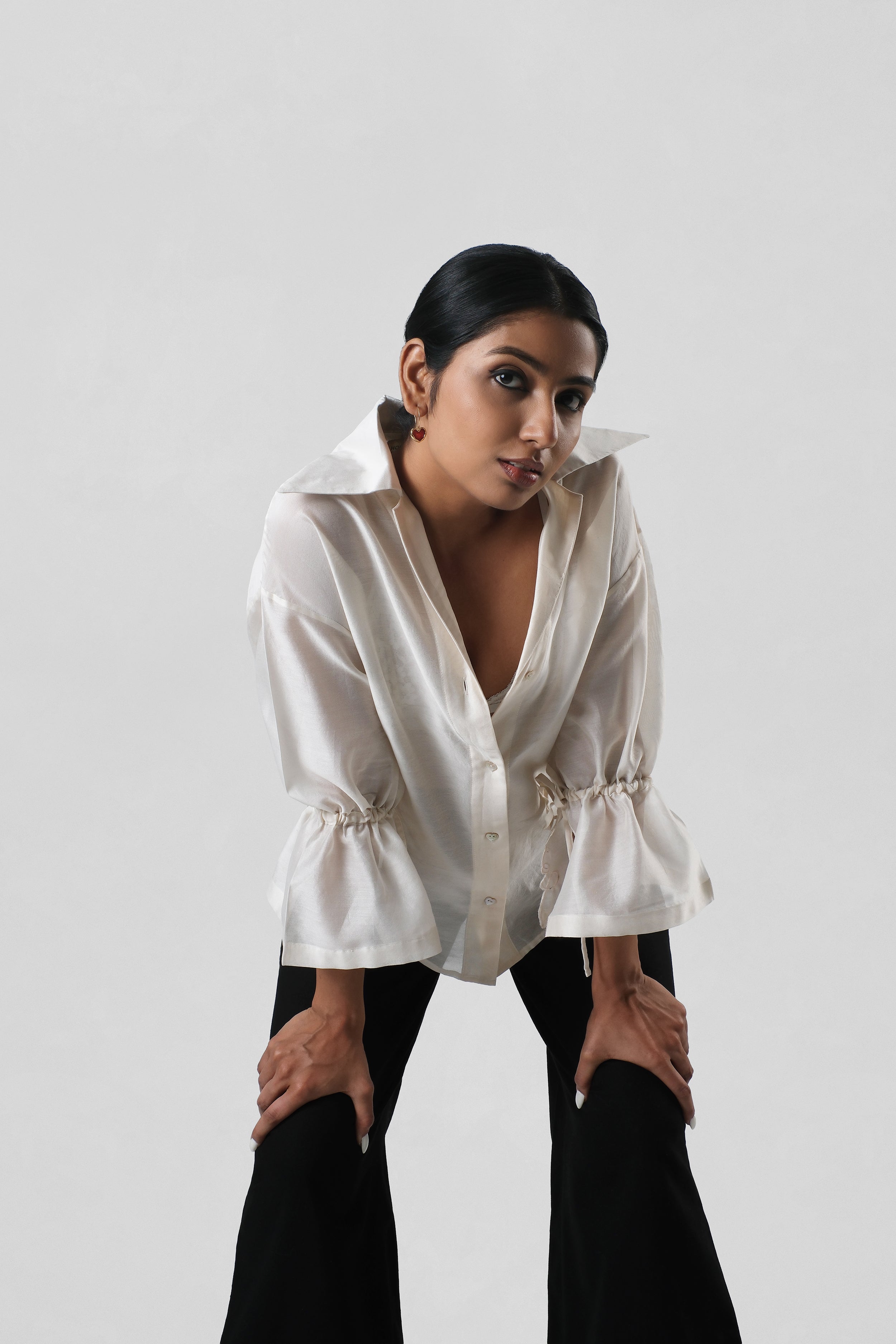 Editorial styling image of the Virginia Shirt paired with tailored trousers for contemporary luxury dressing.