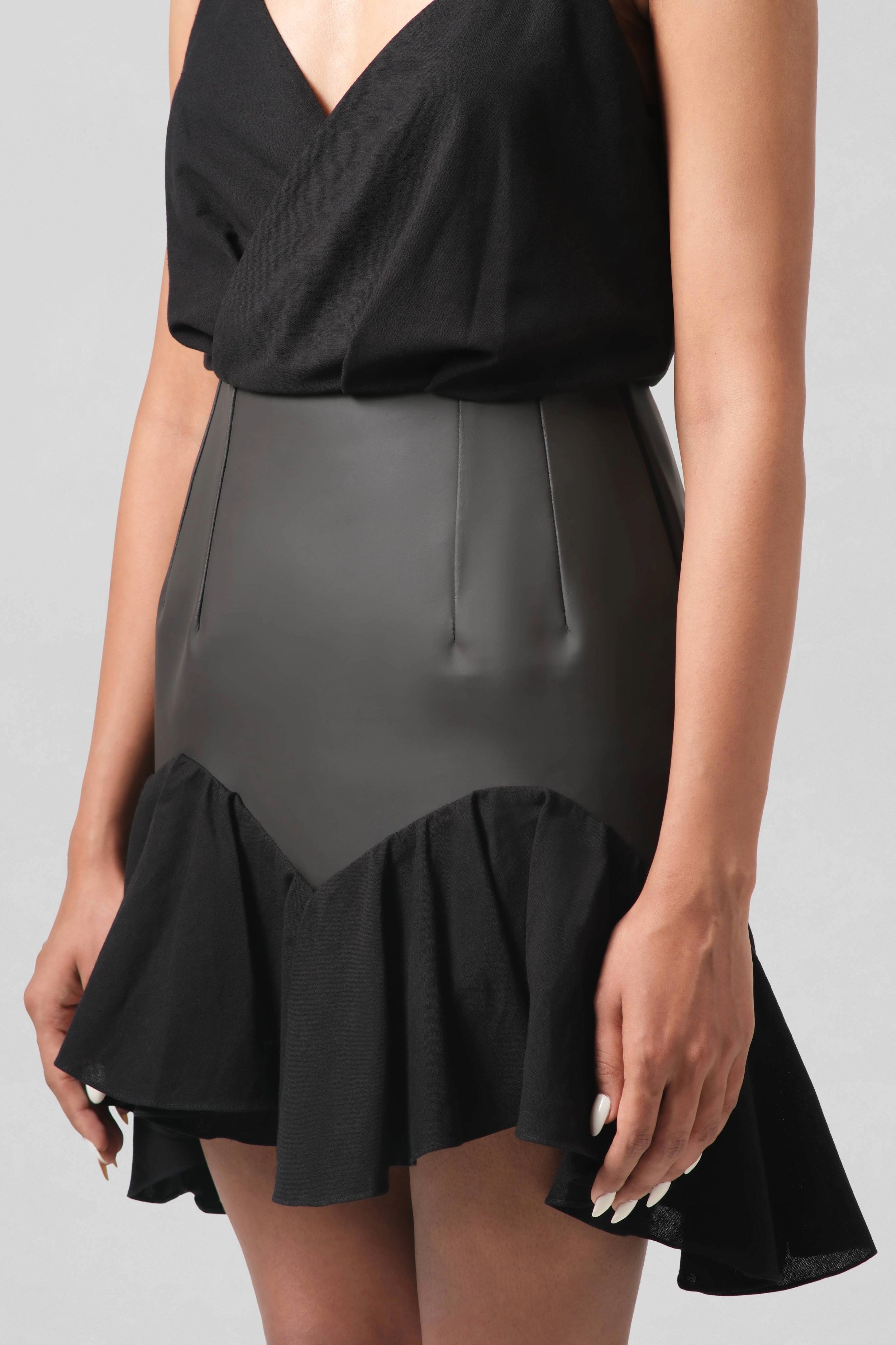 Close-up of the Vivienne Dress showcasing the softly gathered linen skirt and fluid handcrafted silhouette.