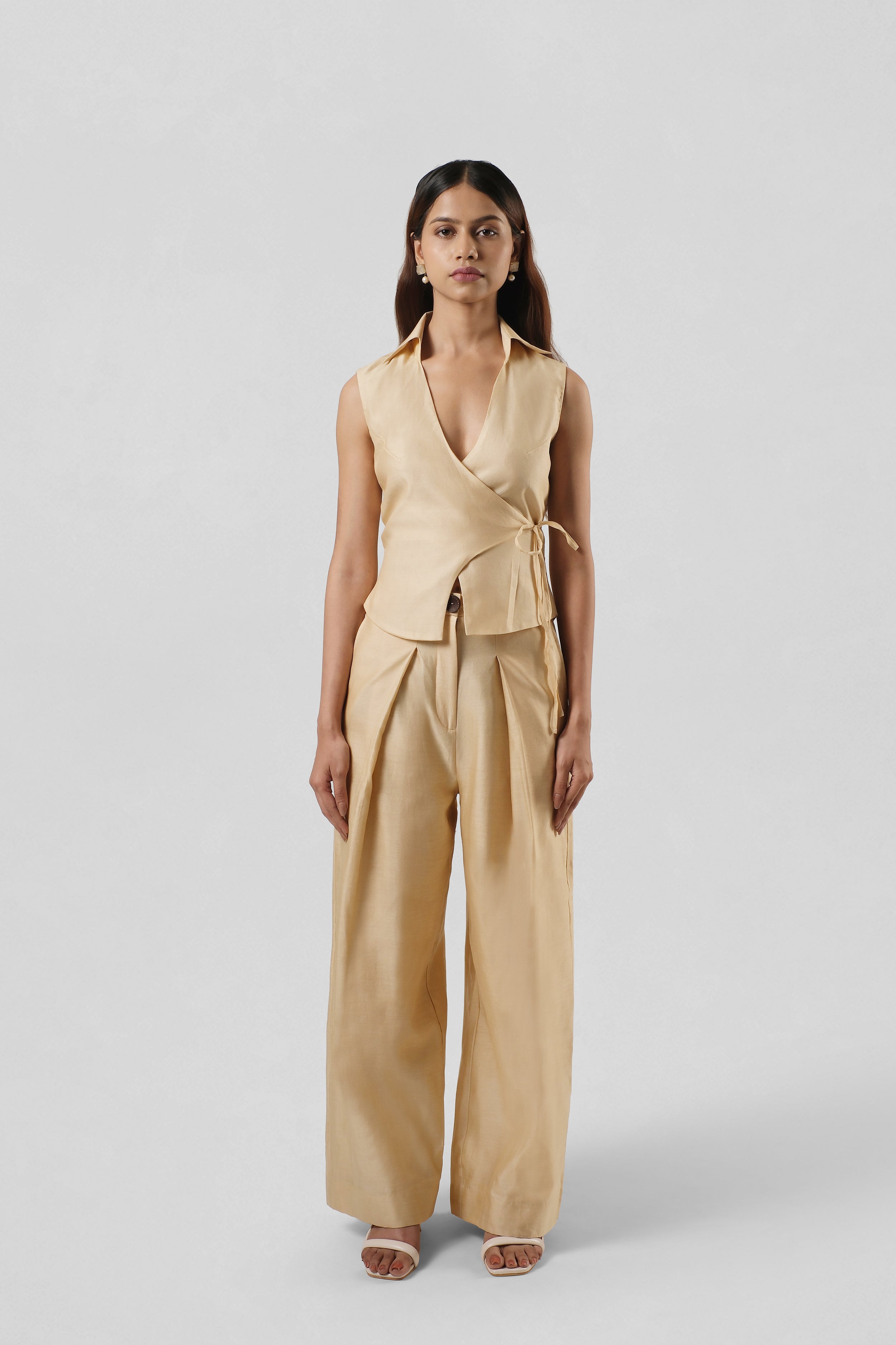 Front view of the Mira Gold Chanderi co-ord set by House of Lore featuring a handcrafted wrap top paired with fluid wide-leg trousers.