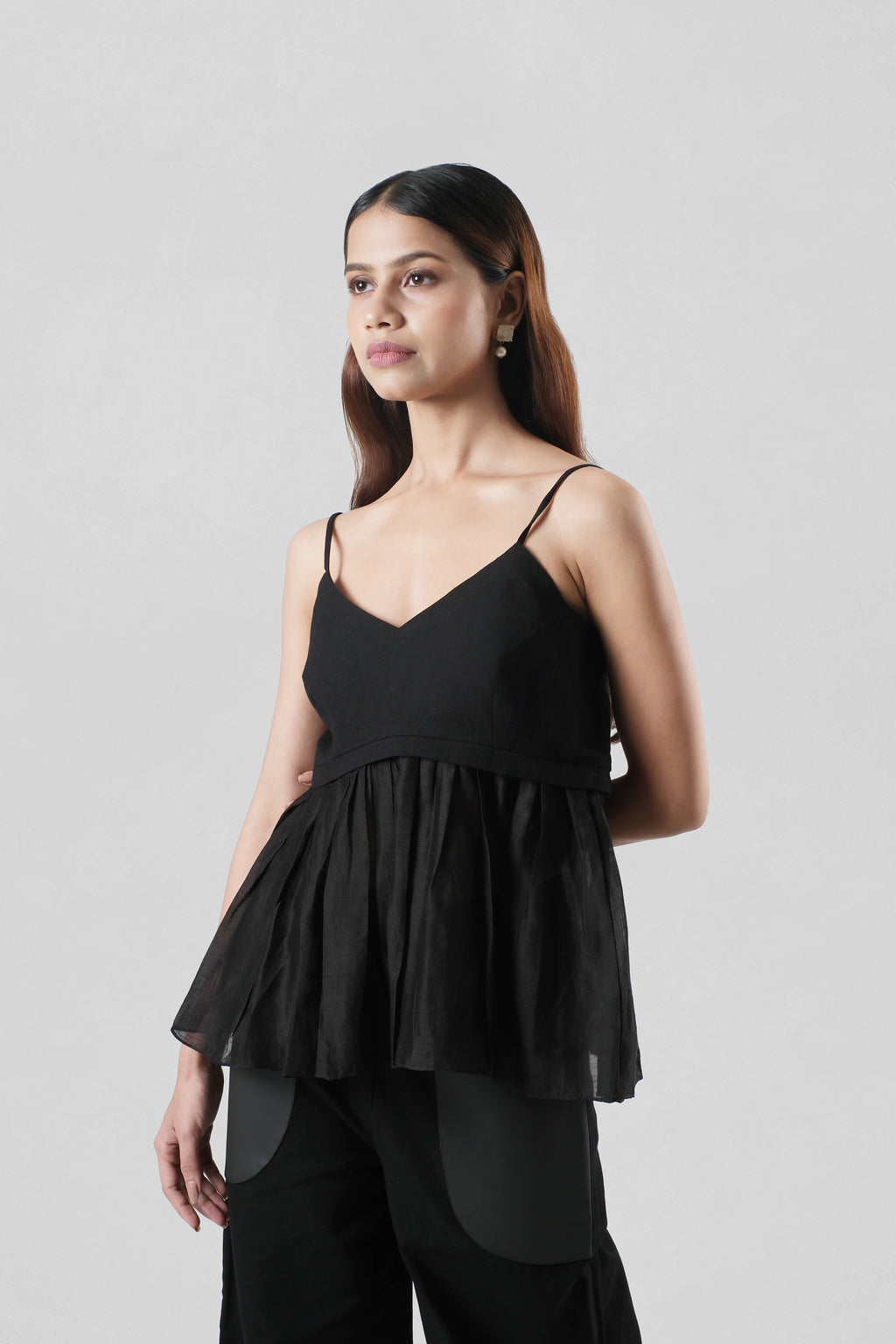 Women's Serena Black Peplum Top crafted in linen and Chanderi featuring a flowing silhouette